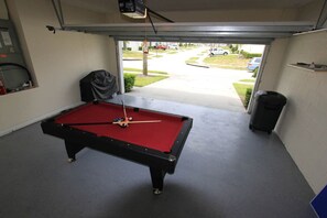 pool table in garage converted game room
