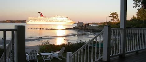  A cruise ship goes by at sunset