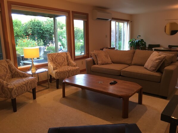 Living room: pull out sofa bed, books, dvds, games, tv, gas fireplace, and a/c.