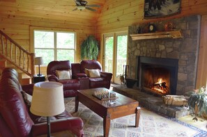 Gather your family and friends in the warmth of the grand living room.