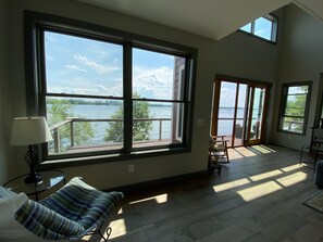 First floor open floor plan. Walls of windows look at 180 degrees of lake!