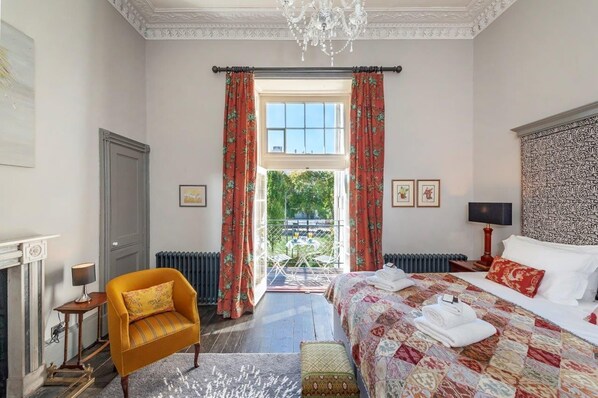 Spacious bedroom with private balcony overlooking the weir