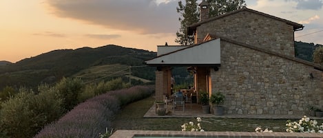 The beautiful stone house seen from the pool area