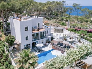 Aerial view of pool side of villa 