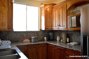 Calmar's kitchen with Granite countertop and stainless steel applicances