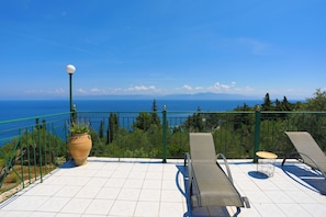Relax onn charming patio with amazing sea views