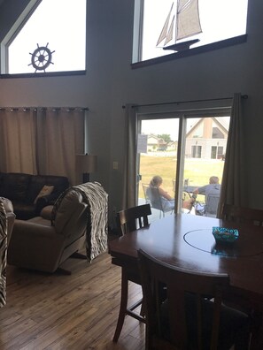Dining Room With Walk Out Patio With Table And Chairs