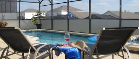 Relax by the pool and enjoy a glass of your favorite beverage