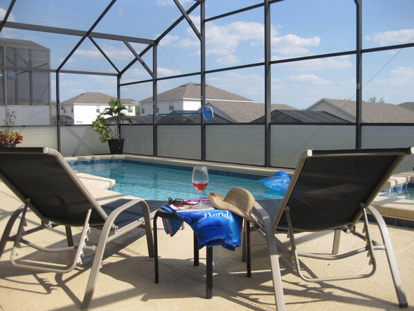 Relax by the pool and enjoy a glass of your favorite beverage