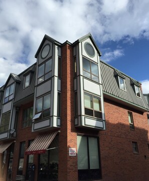 Outside View. All of the upper level windows visible in photo belong this unit