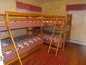 Adorable bunk beds in our Cabin rental. One of the bunks has a pull out bed underneath. 