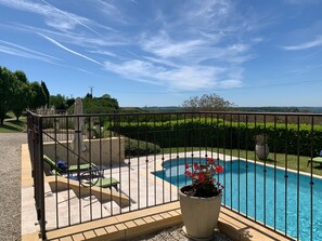 Newly landscaped pool with artisan fencing
