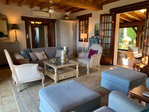 Large comfy salon that opens to veranda