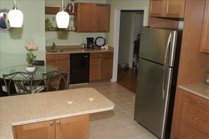 Kitchen with view of wet bar and wine cooler