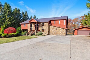 The massive flat driveway can easily fit 8+ cars comfortably in the driveway.