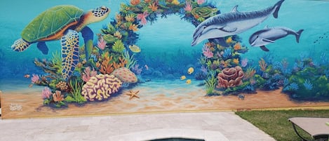 Our hand painted mural done by local artist Cheeta.