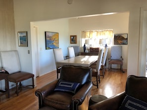 Looking onto Dining room with original Plein Air art of Carmel.