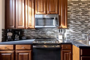 kitchen detail, coffee maker on left, knife block on right