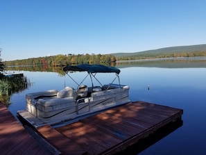 Sweetwater Electric Pontoon boat at our dock. Perfect for fishing, swimming, etc