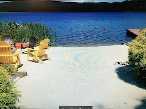 Private swim beach with fire pit and large dock with private pontoon boat/kayaks