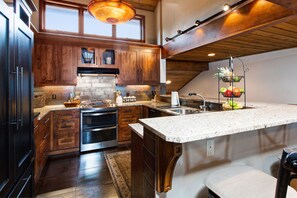 Kitchen with Gas Stove / Oven, Dishwasher, Breakfast Bar