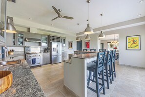 Huge Commercial Kitchen with dishwasher, bar seating for 6, ice maker, and A/C