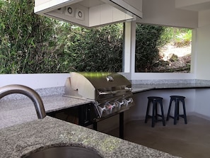 Huge built-in COVERED grill deck with bar counter and sink