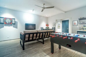 WOW a game room with its own UHDTV and GAMES!!!    Looks like a lot of fun