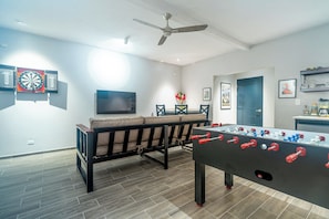 WOW a game room with its own UHDTV and GAMES!!! Looks like a lot of fun