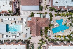 A BIRDS EYE VIEW OF THE SOUTH POOL W/ POOL BAR & NORTH POOL W/ SMALL KIDDIE POOL