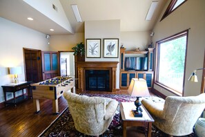 TV, and fireplace in the game room