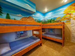 Step inside our hidden bunkbed room with a beautiful mural of Colorado Springs!