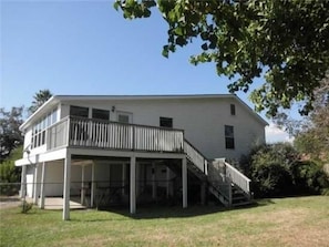 House East side showing balcony and entry.