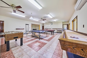 Game room with table tennis, pool table, foosball and shuffleboard