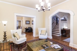 Partial view of Livingroom with peek into front hall and  a bit of dining room.