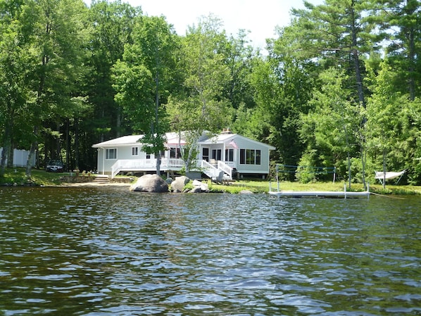 House from the water - private level setting with beach, play area, and dock