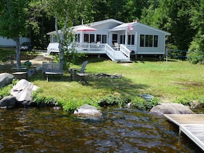 Outside seating on the point near the fire pit and boat dock