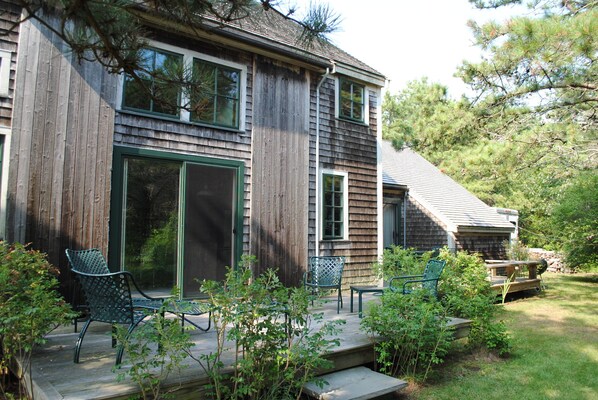 Exterior back.  The porch continues to master bedroom area.