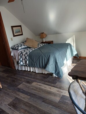full size bed and fold out in second room upstairs. door wall facing the lake
