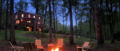 Fire pit with 8 comfortable Adirondack chairs, firewood provided!