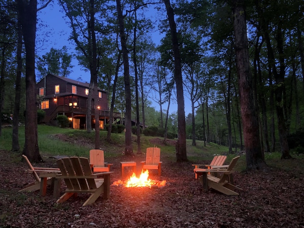 Fire pit with 8 comfortable Adirondack chairs, firewood provided!