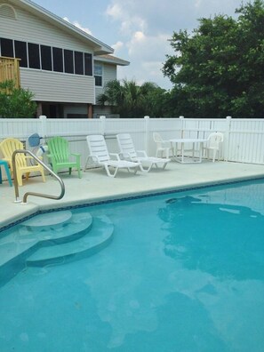 Enjoy relaxing by your private pool with only a short walk to the beach!