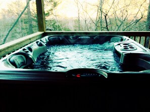 Hottub on screened in porch, overlooks river