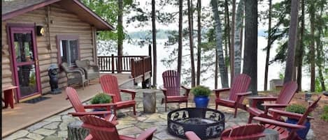 Fire Pit Over Looking Lake and Large Pines with Grilling Area