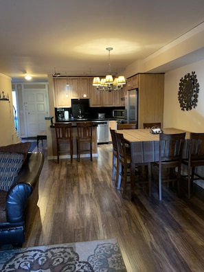 New hardwood floors, great room, full stocked kitchen ready for your to cook