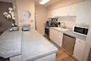 Fully Equipped Kitchen with Oven, Dishwasher, Refrigerator and Microwave