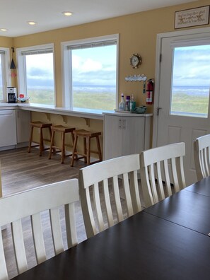 Dining table is steps from the kitchen.