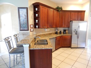 Cherry kitchen cabinets wi new granite countertops and new appliances