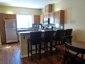 Four leather barstools so the cook is never lonely