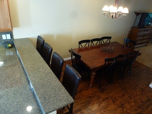 Table expands to seat 12, with movable benches for everyone to dine together